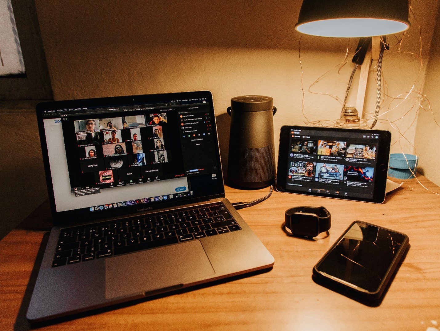 Laptop, tablet, and phone on desk