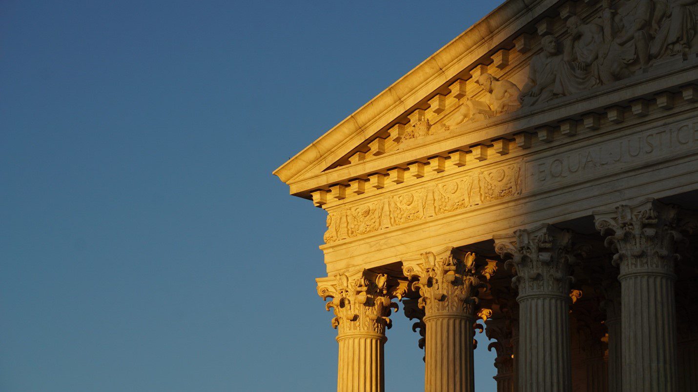 Building with columns under a shadow