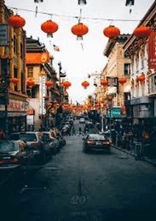 Sunlit street with paper lanterns