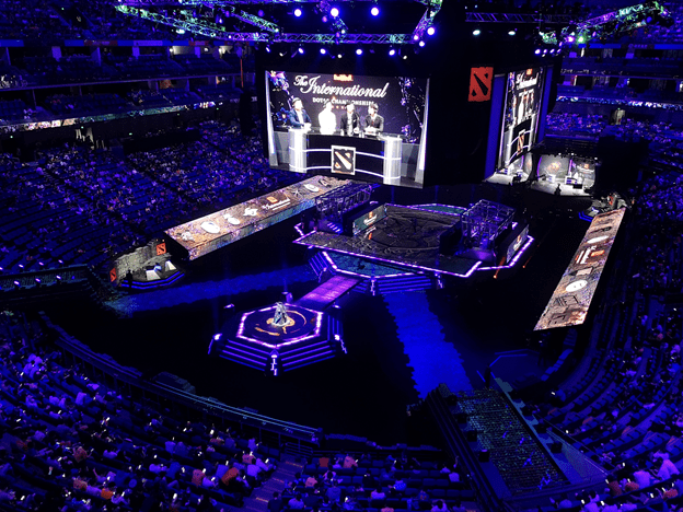 Full arena with screens and spotlights